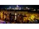 Night view of building exterior with city skyline in the background at 12119 Brooklyn Ave, Charlotte, NC 28204