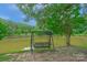 Relaxing swing overlooking serene pond at 15610 Youngblood Rd, Charlotte, NC 28278