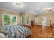Main bedroom with hardwood floors and access to en-suite bath at 15610 Youngblood Rd, Charlotte, NC 28278
