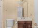 Simple bathroom with a single vanity, toilet, and tiled shower at 15610 Youngblood Rd, Charlotte, NC 28278