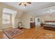 Spacious main bedroom with hardwood floors and a sitting area at 15610 Youngblood Rd, Charlotte, NC 28278