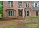 Front entrance with brick walkway and stone accents at 15610 Youngblood Rd, Charlotte, NC 28278