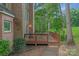 Spacious wooden deck with seating area, overlooks private backyard at 15610 Youngblood Rd, Charlotte, NC 28278