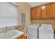 Laundry room with washer, dryer, and cabinets at 15610 Youngblood Rd, Charlotte, NC 28278