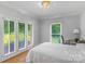 Bedroom with access to a patio, hardwood floors at 15610 Youngblood Rd, Charlotte, NC 28278