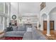 Living room with sectional sofa, hardwood floors, and view into kitchen area at 15610 Youngblood Rd, Charlotte, NC 28278