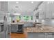 Modern kitchen with granite countertops and stainless steel appliances at 15610 Youngblood Rd, Charlotte, NC 28278