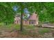 Brick home with a patio and wooded backyard at 15610 Youngblood Rd, Charlotte, NC 28278