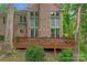 Large deck with seating area, brick home exterior at 15610 Youngblood Rd, Charlotte, NC 28278