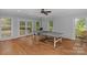 Spacious game room with hardwood floors and a ping pong table at 15610 Youngblood Rd, Charlotte, NC 28278