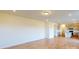Open concept living area with hardwood floors and kitchen access at 1813 Augustine St, Monroe, NC 28112