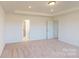 Main bedroom with access to bathroom and carpet at 1813 Augustine St, Monroe, NC 28112