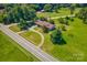 Aerial view showing house, road, and surrounding landscape at 5625 Highway 601 Hwy, Salisbury, NC 28147