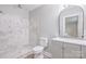 Updated bathroom with marble shower and grey vanity at 5625 Highway 601 Hwy, Salisbury, NC 28147