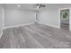 Bright living room with vinyl flooring and access to other rooms at 5625 Highway 601 Hwy, Salisbury, NC 28147
