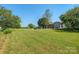 House with expansive side yard and green grass at 5625 Highway 601 Hwy, Salisbury, NC 28147