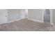 Bedroom with wood-look flooring and access to full bathroom at 5625 Highway 601 Hwy, Salisbury, NC 28147