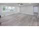 Spacious living room with gray vinyl flooring and ceiling fan at 5625 Highway 601 Hwy, Salisbury, NC 28147