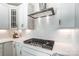 Gas cooktop with white quartz countertops and white hexagonal backsplash at 102 Ballantree Rd # 70, Mooresville, NC 28115