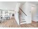 Elegant staircase with wooden railings leading to the second floor at 102 Ballantree Rd # 70, Mooresville, NC 28115