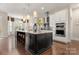 Spacious kitchen with island, stainless steel appliances, and granite countertops at 15814 Vale Ridge Dr, Charlotte, NC 28278