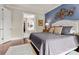 Main bedroom with ensuite bathroom and blue accent wall at 15814 Vale Ridge Dr, Charlotte, NC 28278