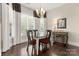 Bright dining room with hardwood floors and large windows at 15814 Vale Ridge Dr, Charlotte, NC 28278