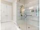 Elegant bathroom with a large walk-in shower and marble tile at 15814 Vale Ridge Dr, Charlotte, NC 28278