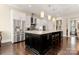 Modern kitchen featuring stainless steel appliances and a large island at 15814 Vale Ridge Dr, Charlotte, NC 28278