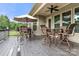 Spacious deck with table, chairs, and umbrella at 15814 Vale Ridge Dr, Charlotte, NC 28278
