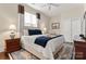 Bright bedroom featuring a comfortable bed and hardwood floors at 15814 Vale Ridge Dr, Charlotte, NC 28278