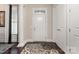 Bright entryway with hardwood floors, columns and a rug at 15814 Vale Ridge Dr, Charlotte, NC 28278