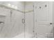 Spacious shower with glass enclosure and marble tile at 15814 Vale Ridge Dr, Charlotte, NC 28278