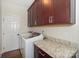 Laundry room with washer, dryer, and granite countertop at 13950 Cinnabar Pl, Huntersville, NC 28078