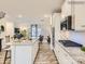 Modern kitchen with island, granite counters and stainless steel appliances at 4062 Skyboat Cir, Fort Mill, SC 29715