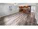 Dining area with wood-look floors and kitchen access at 8819 Richardson King Rd, Waxhaw, NC 28173
