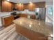 Modern kitchen with granite countertops and wood cabinets at 8819 Richardson King Rd, Waxhaw, NC 28173