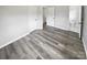 Well-lit bedroom with grey flooring and access to a bathroom at 8819 Richardson King Rd, Waxhaw, NC 28173