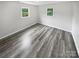 Bright bedroom with wood-look floors and neutral walls at 8819 Richardson King Rd, Waxhaw, NC 28173