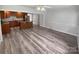 Dining area with wood-look floors and kitchen access at 8819 Richardson King Rd, Waxhaw, NC 28173