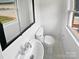 Clean half bathroom with white sink and toilet at 8819 Richardson King Rd, Waxhaw, NC 28173