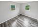 Spacious bedroom featuring grey vinyl flooring and dual windows at 8819 Richardson King Rd, Waxhaw, NC 28173