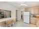 Kitchen with breakfast bar and view into living room at 6825 Highbrook Dr # 13, Charlotte, NC 28212