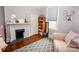 Lovely bedroom with a fireplace, built-in shelves, and hardwood floors at 102 2Nd Sw St # 1, Catawba, NC 28609