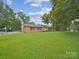 Brick ranch house with attached garage and large yard at 100 Nottingham Way, Wadesboro, NC 28170