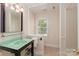 Simple bathroom with a window and shower at 9808 Warwick Cir, Charlotte, NC 28210