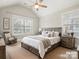 Cozy bedroom with wooden bed frame and neutral decor at 4624 Pebble Run Dr, Matthews, NC 28105