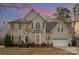 Two-story house with attached garage and landscaping at 6504 Sybil Ct, Indian Trail, NC 28079