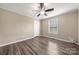 Bedroom with ceiling fan, window with blinds, and wood-look floors at 115 Crystal Bay Dr, Mooresville, NC 28115