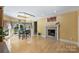 Bright dining area with hardwood floors and fireplace at 118 Broadbill Dr, Mooresville, NC 28117